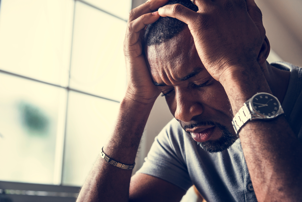 Man suffering from depression as a result of chronic pain.