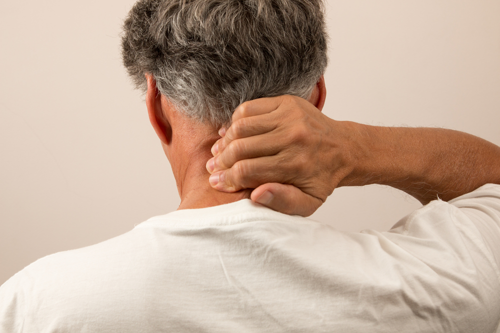 older man with neck pain