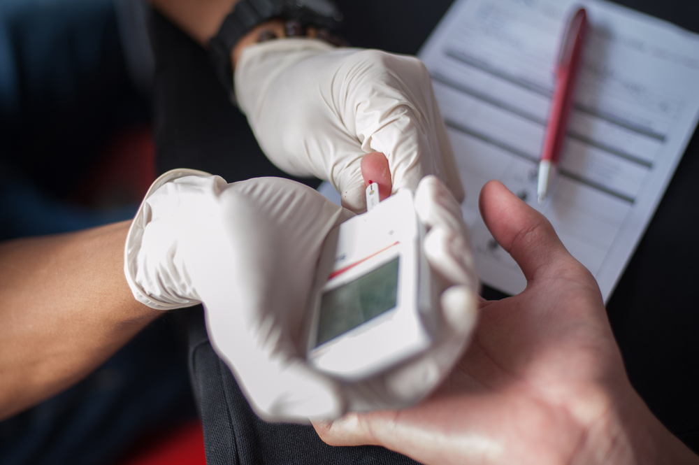 finger stick to check blood glucose levels